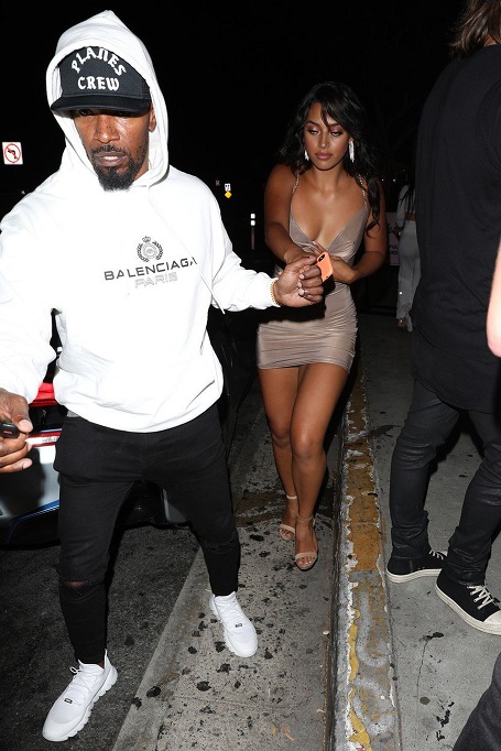 Jamie Foxx was guarding Sela Vave as they walk out of a party.